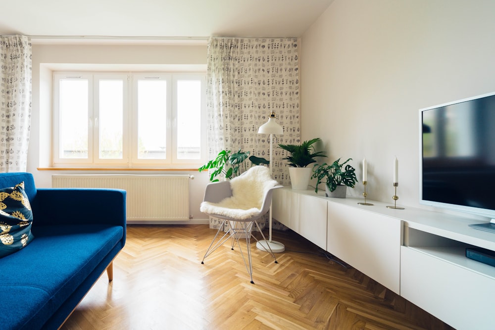 Scandinavian living room with blue sofa
